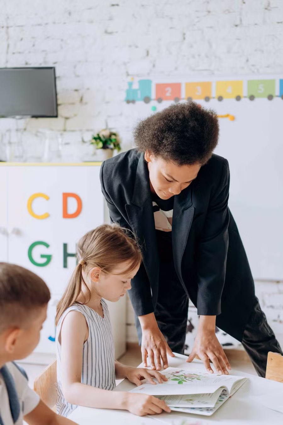 aba therapist with child in clinic center
